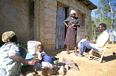 Woman washing clothes outside shack, Godet, Haiti, island of Hispaniola, West Indies, Central America