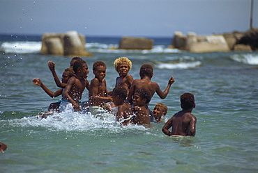 Boys playing in the sea, Lenakel, Tanna, Vanuatu, Pacific Islands, Pacific