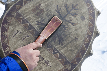 Buryat shaman Valentin Khagdaev Olkhon Island, with skin drum preparing for ceremony to celebrate the spirit of Baikal, Lake Baikal, Irkutsk Oblast, Siberia, Russia, Eurasia