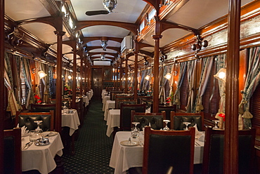 Galleried wood panelled Edwardian vintage dining coach on the Rovos Rail luxury train, Western Cape, South Africa, Africa