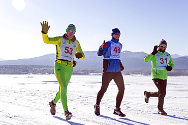 Runners in the 10th Baikal Ice Marathon, run on the frozen surface of the world's largest fresh water lake on 1st March 2014, Siberia, Irkutsk Oblast, Russia, Eurasia