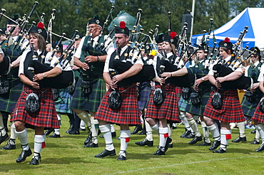 Massed pipers of the Dufftown and District pipe band, Scottish Highland Games, Scotland, United Kingdom, Europe