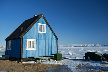 Colourful wooden house in the village of Qaanaaq, one of the most northerly human settlements on the planet and home to 656 mostly Inuit people, Greenland, Denmark, Polar Regions