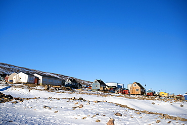 Colourful wooden houses in the village of Qaanaaq, one of the most northerly human settlements on the planet and home to 656 mostly Inuit people, Greenland, Denmark, Polar Regions