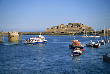 Ferry passing Castle Cornet, St. Peter Port, Guernsey, Channel Islands, United Kingdom, Europe