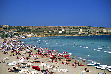 Tourists on the beach at Mellieha Bay on the island of Malta, Mediterranean, Europe