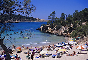 Crowded beach at Portinatx, Ibiza, Baleares, (Spain)