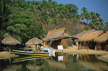 Boats and thatched huts at Mismaloya, near Puerto Vallarta, Mexico, North America