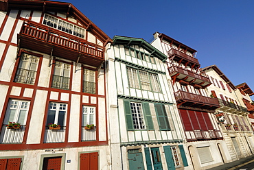 Colourful old houses along harbour of Ciboure, near St. Jean de Luz, Pyrenees Atlantique, France, Europe