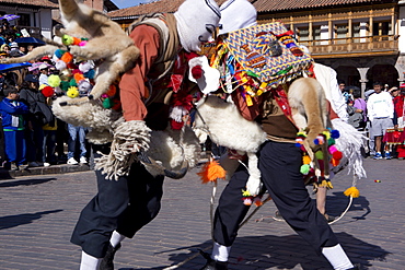 Men with whips hitting each other during the festivities of Corpus Christi, the most important religious festival in Peru, held in Cuzco, Peru, South America