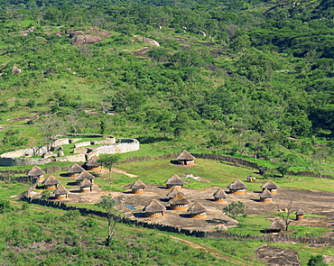 Nearby huts and Great Zimbabwe National Monument, UNESCO World Heritage Site, Zimbabwe, Africa