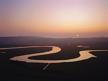 Sunset over the River Cuckmere at Cuckmere Haven, East Sussex, England, UK, Europe