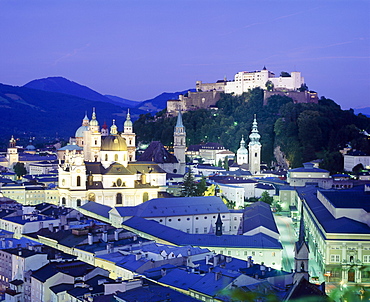 The cathedral and fortress illuminated at night in the town of Salzburg, Austria 