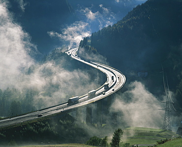 Cloud on either side of elevated road at the Brenner Pass in Austria, Europe