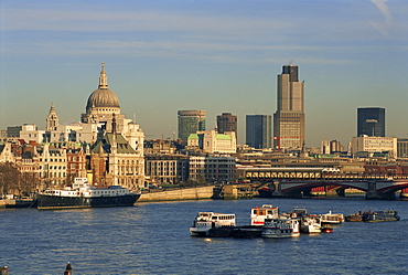 City skyline, including St. Paul's Cathedral, the NatWest Tower and Southwark Bridge, from across the Thames at dusk, London, England, United Kingdom, Europe