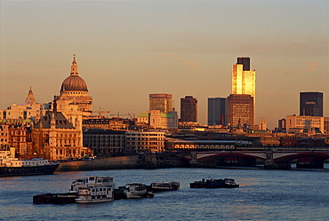 City skyline, including St. Paul's Cathedral, the NatWest Tower and Southwark Bridge, from across the Thames at dusk, London, England, United Kingdom, Europe