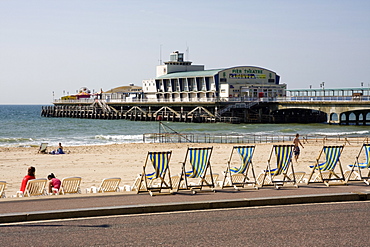 Deckchairs, beach and pier, Bournemouth, Dorset, England, United Kingdom, Europe