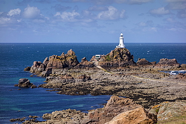 Corbiere Lighthouse and rocky coastline, Jersey, Channel Islands, United Kingdom, Europe