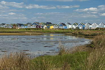 Beach huts and Lagoon, Mudeford Spit, Christchurch Harbour, Dorset, England, United Kingdom, Europe