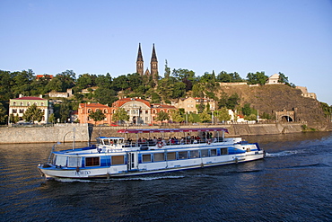 High Castle (Vysehrad) and river boat on Vltava River, Prague, Czech Republic, Europe