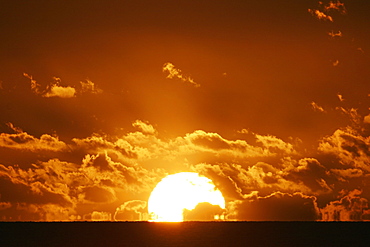 Sun setting over the sea with light clouds, Fiji, South Pacific, Pacific