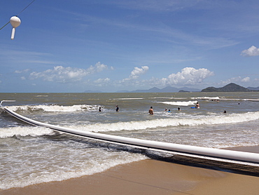 People swimming within stinger protection net at Palm Cove, Cairns, North Queensland, Australia, Pacific