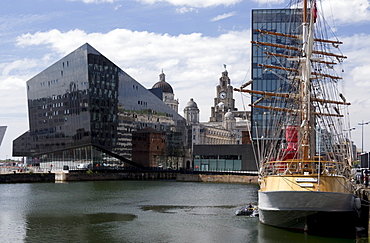 Part of Port of Liverpool Building and Royal Liver Building seen across Canning Dock with sailing ship Kaskelot, Liverpool, Merseyside, England, United Kingodm, Europe