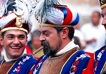 Alcoy,Alicante,Spain - A cigar completes the costume during the annual Moors and Christians celebrations