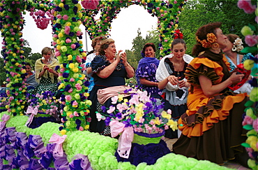 Cordoba - Spain - A float with floral theme in the parade at a local fiesta in Cordoba city