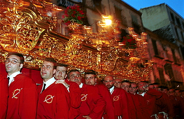 Malaga-Spain - Easter Week (Semana Santa) - Some of the one hundred members of a brotherhood required to carry the religious floats 