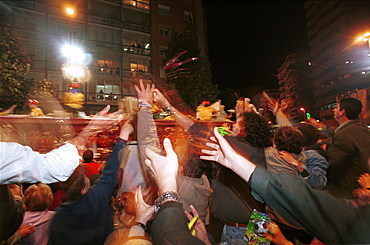 Murcia - Spain Spring Festivals - Burial of the Sardine Spectators reach out for gifts thrown from the floats 