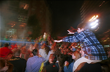 Murcia - Spain Spring Festivals - Burial of the Sardine Spectators reach out for gifts thrown from the floats 