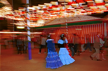 Seville - Spain - The Feria de Abril - Seville Fair - Costumes on view during the night at the fairground