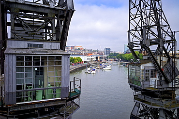 Old dockside cranes frame the harbour, Bristol, England, United Kingdom, Europe