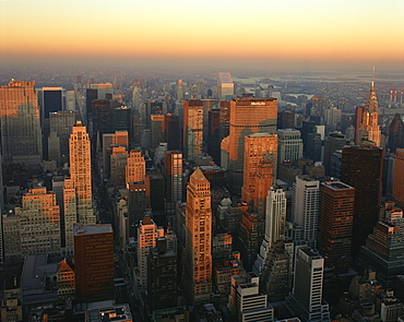 The Manhattan skyline at dusk, including the Chrysler Building, viewed from the Empire State Building, New York City, United States of America, North America