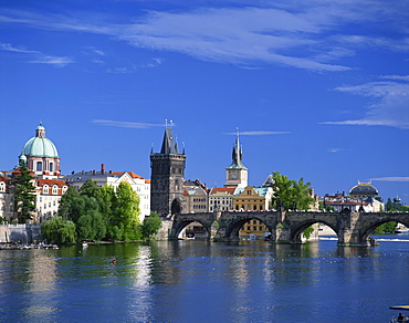 The Charles Bridge over the Vltava River and city skyline of Prague, Czech Republic, Europe