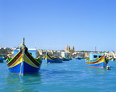 Painted boats in the harbour at Marsaxlokk, Malta, Mediterranean, Europe