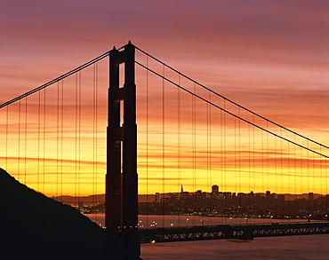 Sunrise at the Golden Gate Bridge, with city skyline in the background, San Francisco, California, United States of America, North America