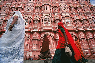 Women in saris walking past the Palace of the Winds (Hawa Mahal), Jaipur, Rajasthan state, India, Asia