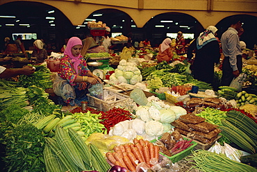 Woman selling vegetables from her stall in the central market in Kota Bharu, Malaysia, Southeast Asia, Asia