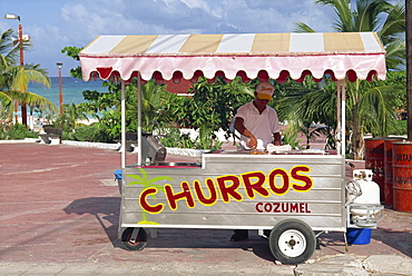 A churros seller, at Playa del Carmen, Mexico, North America