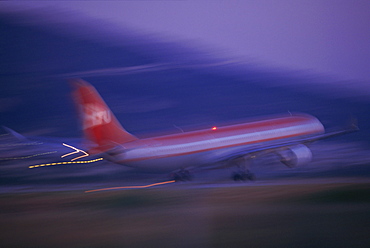 Plane landing or taking off at dusk