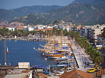 Gulets in the harbour with the town and hills in the background, at Marmaris, Anatolia, Turkey, Asia Minor, Eurasia