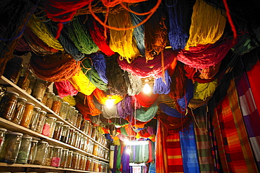Brightly dyed wool hanging from roof of a shop, Marrakech, Morocco, North Africa, Africa 