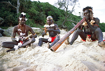 Three Aborigines playing musical instruments, Northern Territory, Australia, Pacific