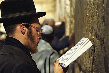 Close-up of Orthodox Jew praying with a book in his hand at the Western Wall in Jerusalem, Israel, Middle East