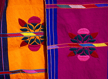 Brightly coloured craft rugs on display at San Cristobal de las Casas, in Chiapas, Mexico, North America