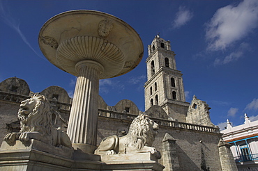 Lion fountain and church beyond, Plaza San Fransisco de Asis, Havana, Cuba, West Indies, Central America