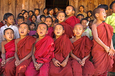 Group of school children, including young monks, singing, village of Thit La, Shan State, Myanmar (Burma), Asia