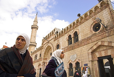 Two women walking past King Hussein Mosque, downtown area, Amman, Jordan, Middle East